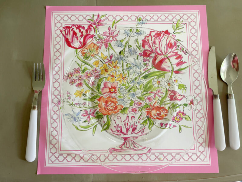spring flower placemats with clear glass charger and white silverware