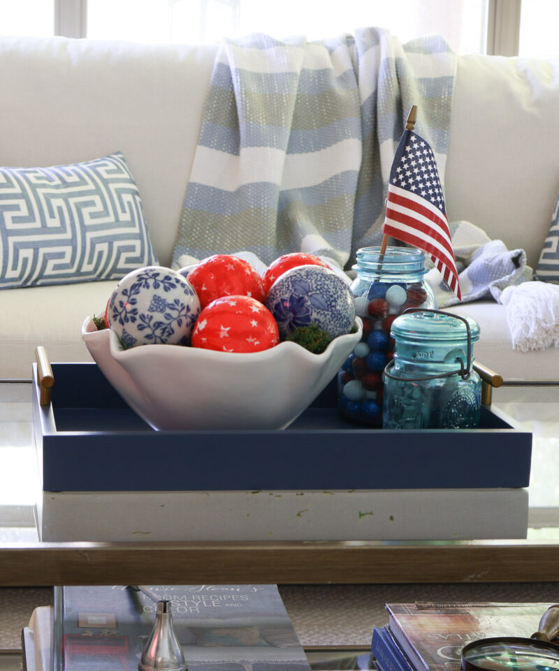 DIY decoupage red star balls in bowl on coffee table