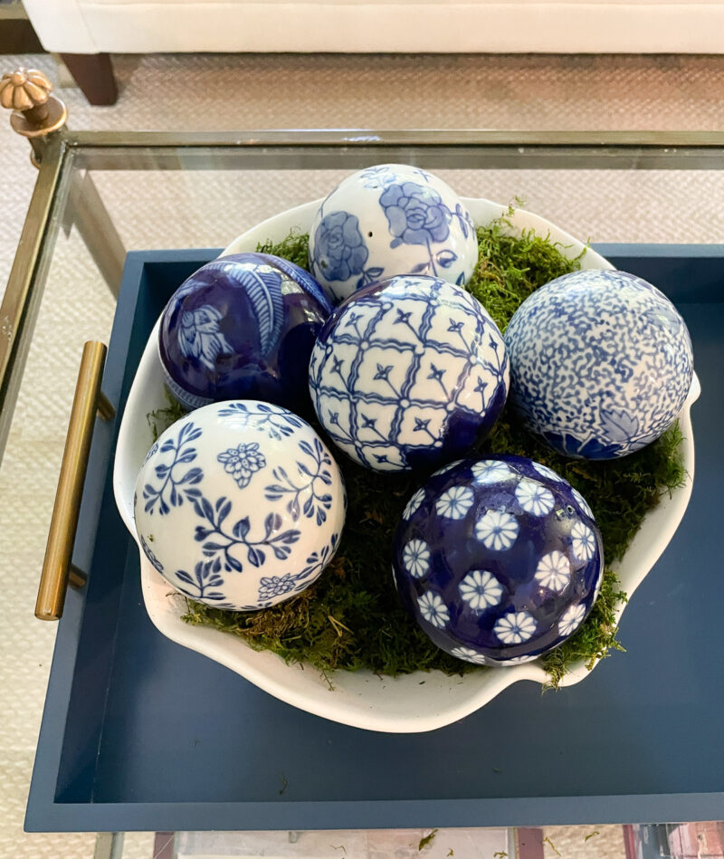 six ceramic chinoiserie balls in white bowl