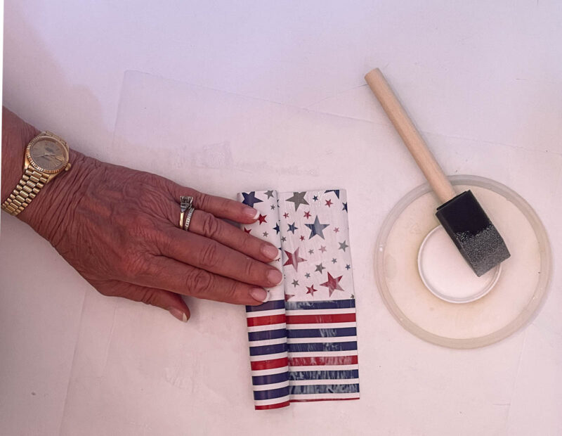 rolling up the piece of paper with glue to make a tube