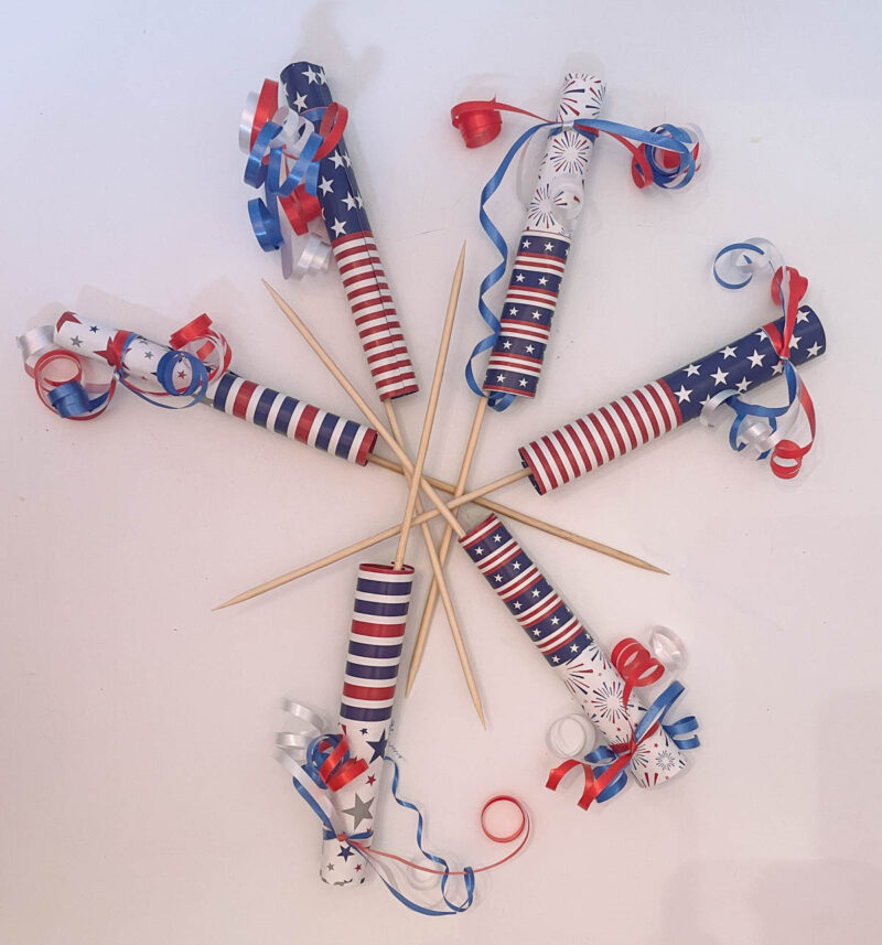firecrackers with ribbon at top
