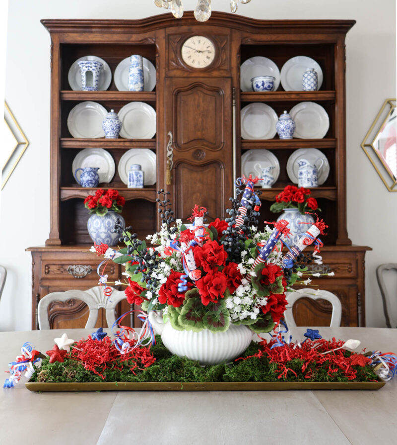 red, blue, and blued 4th of July centerpiece with DIY firecrackers on dinning room table