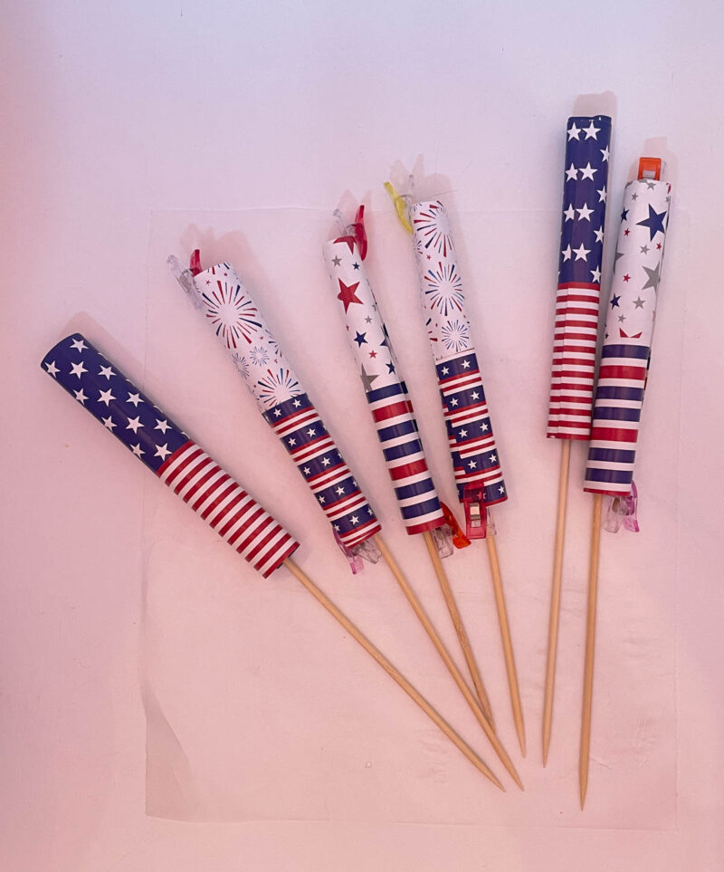 firecrackers drying with wood skewer glued inside