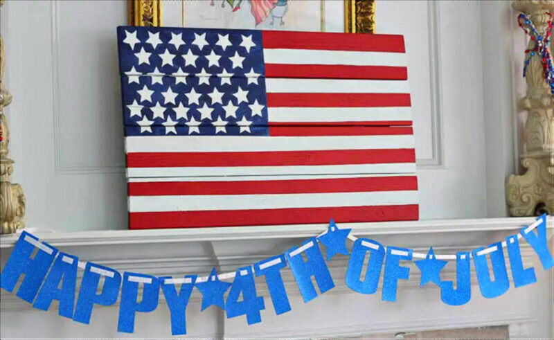 American wood flag on the mantel with blue 4th of July banner