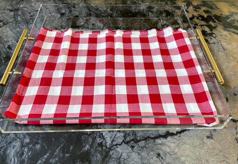 clear acrylic tray with red gingham fabric