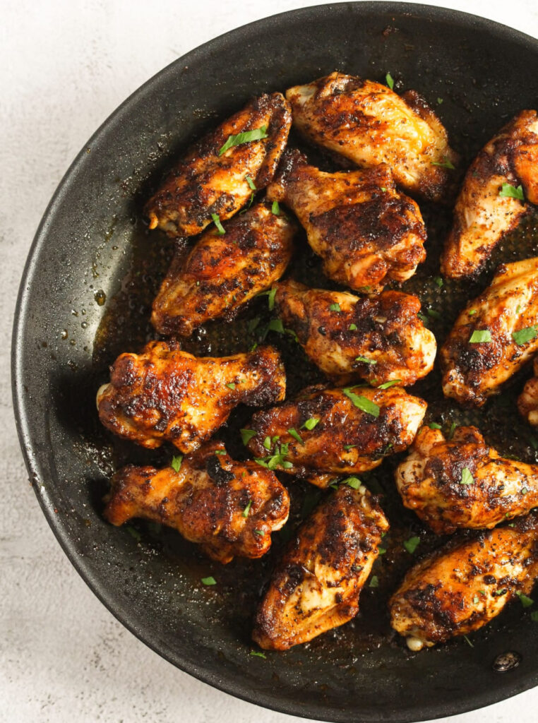 pan fried chicken wings in skillet