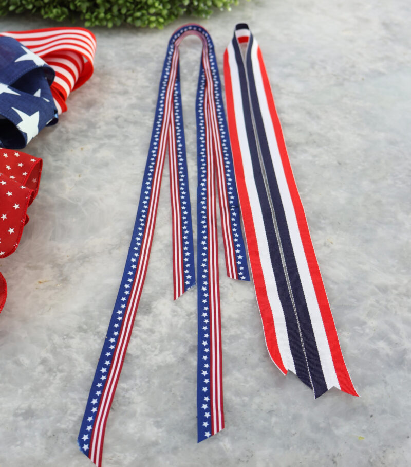 long pieces of red, white and blue ribbon for wreath