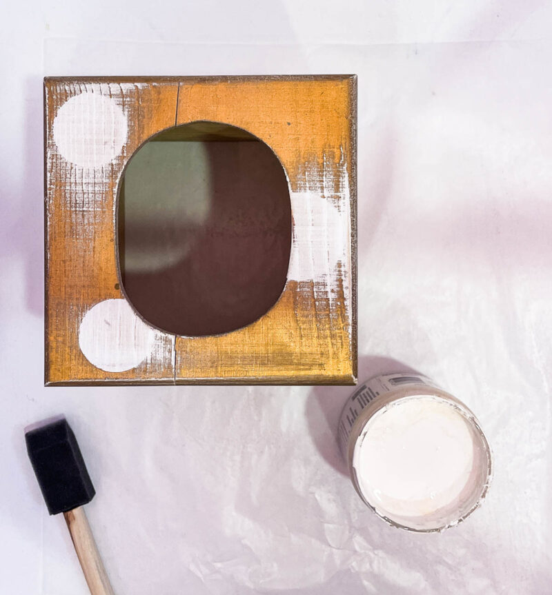 tissue box with white paint and brush