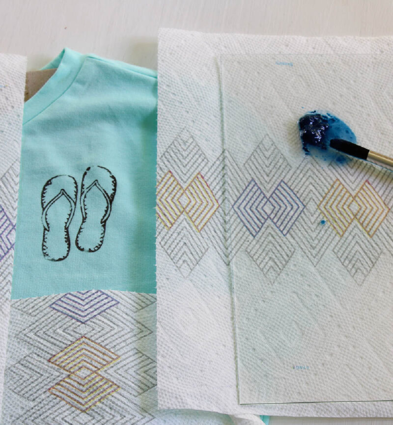 applying stencil to front of t-shirt