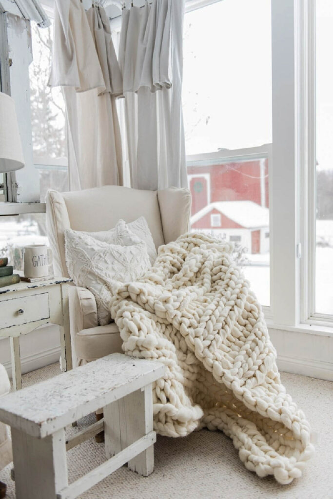 white chair with white chunky throw