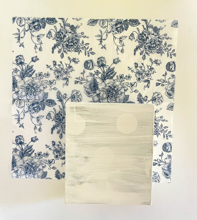 tissue box on top of decoupage paper