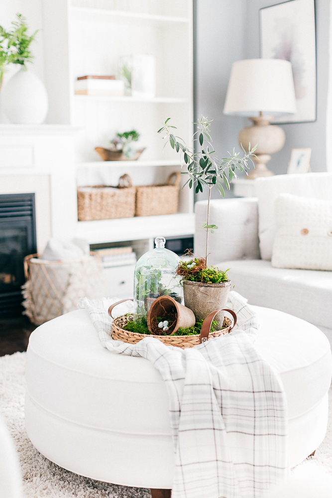 white living room with white ottoman