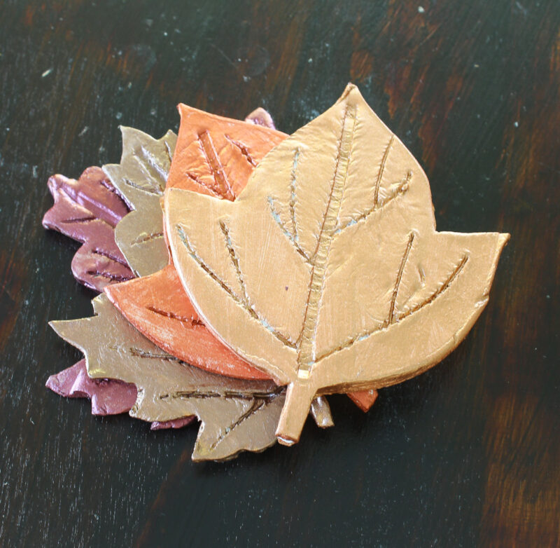 stack of air dry clay painted coasters