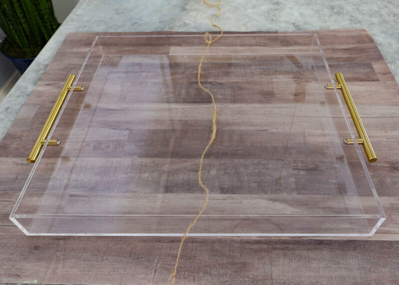 twine across acrylic tray