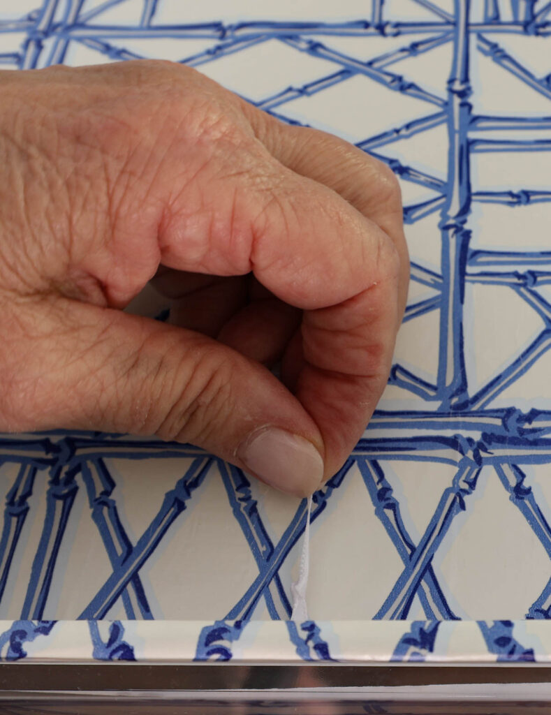 knot in white ribbon for acrylic tray project