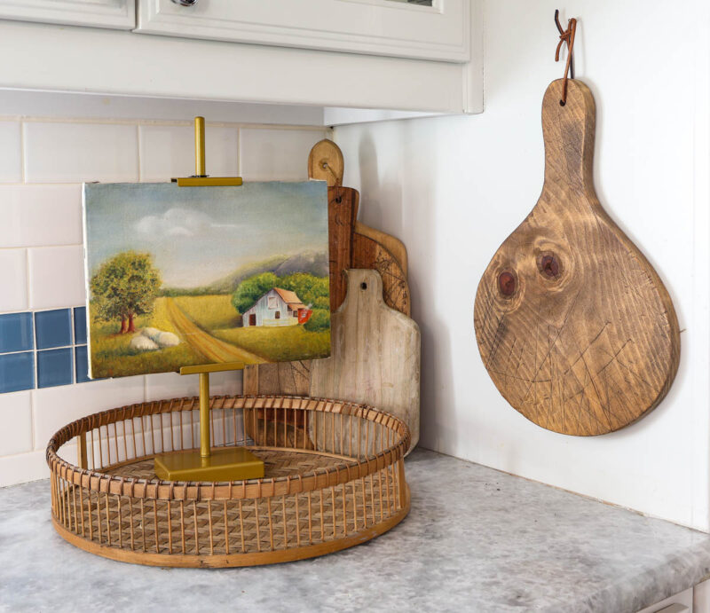 canvas art on adjustable stand on woven tray