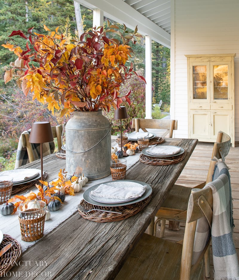 outdoor rustic  fall tablescape on covered porch