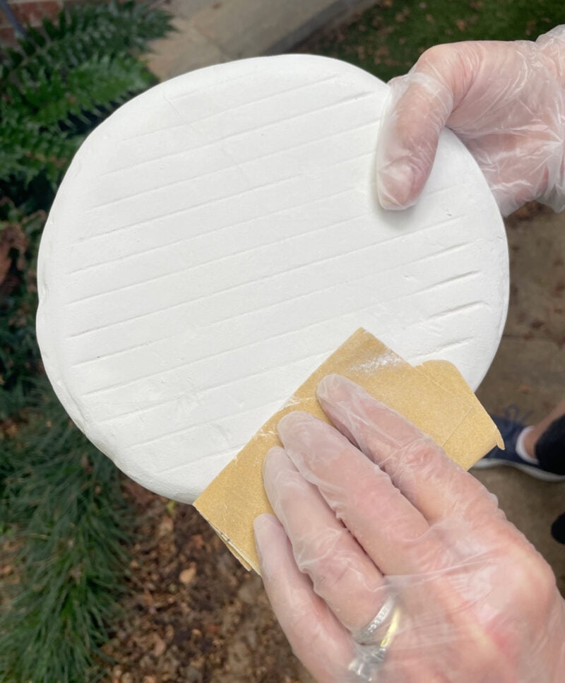 sanding the bottom of the tray