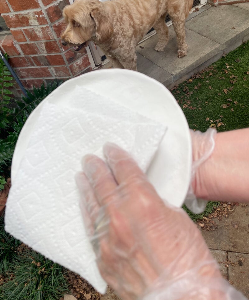 wiping off the dush of the clay tray