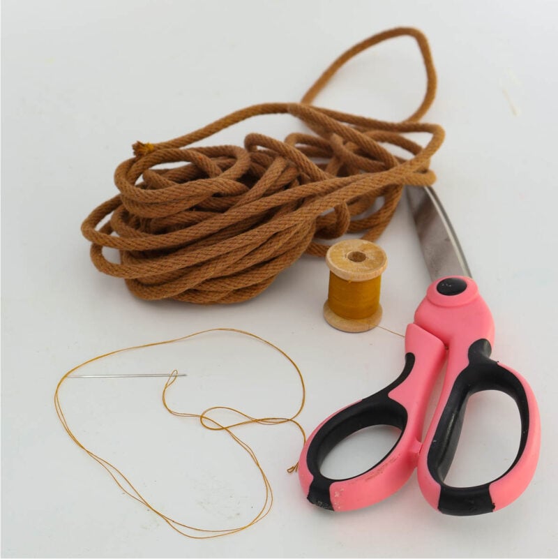coaster project supplies: braid rope, scissors, thread, needle