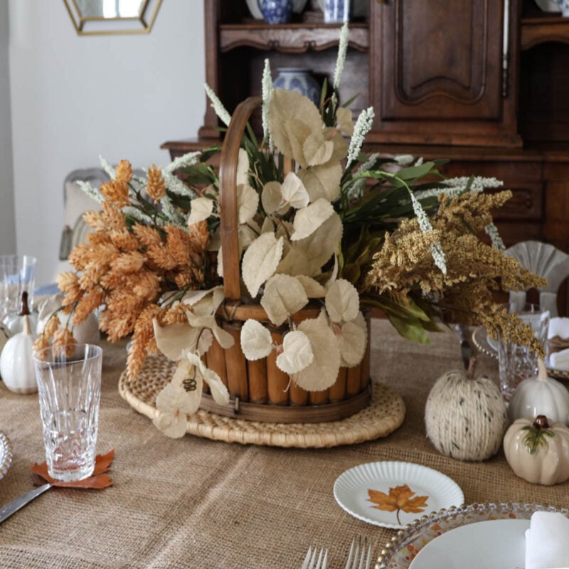 faux flowers in a wood basket on a fall tablescape