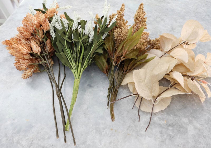 four different fall faux flowers 