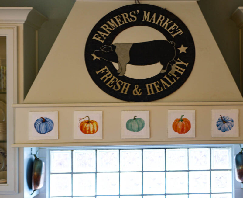 decorative fall faux pumpkin tiles on stovetop hood