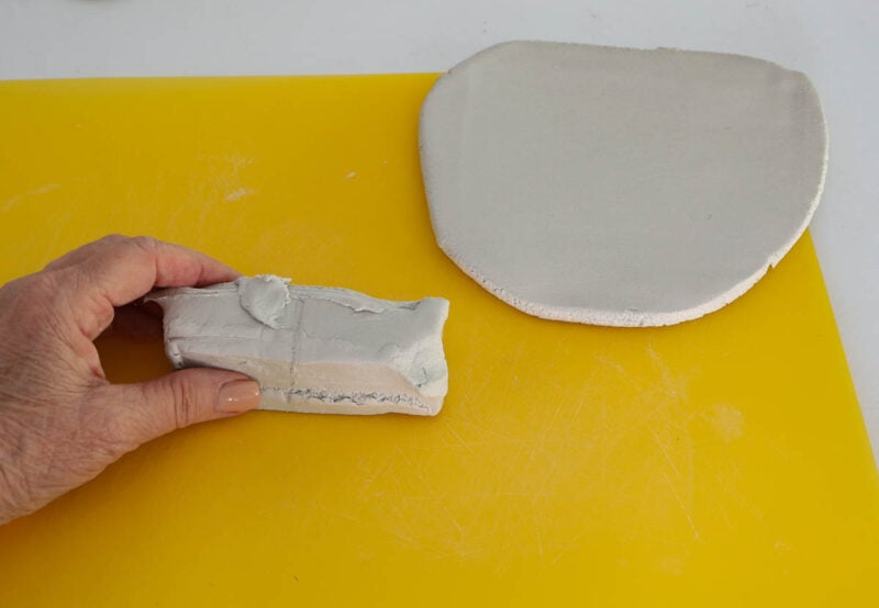 small piece of ari-dry clay with circle of clay