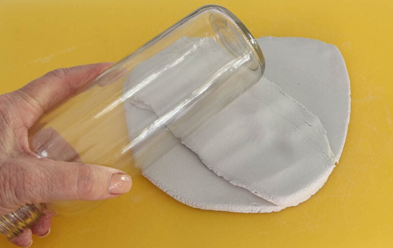 pounding air-dry- clay with glass bottle