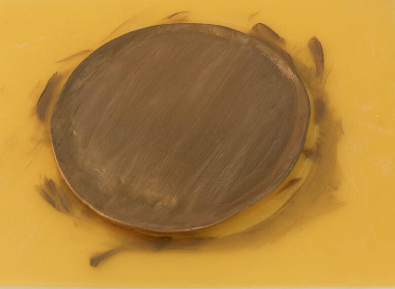 applying second coat of metallic paint to tray